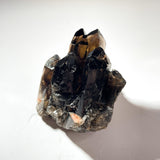 Close up look of a smoky cluster in a crystal healing kit